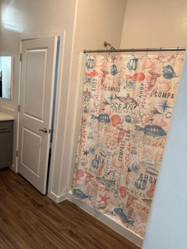 a bathroom with a shower curtain in a room at 3 bedroom private villa in Phoenix