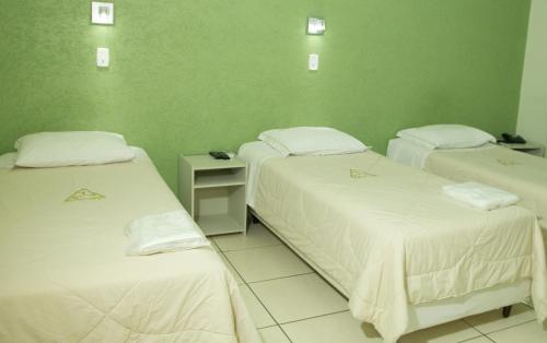 Katil atau katil-katil dalam bilik di Hotel Meri Conselheiro Lafaiete