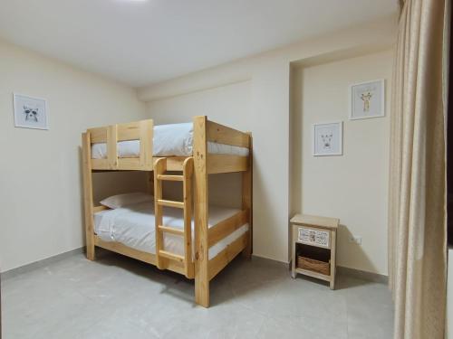 a bedroom with two bunk beds in a room at koi Residencial 301 in Chimbote