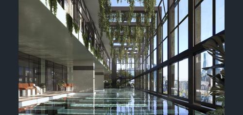a building with a pool in the middle of a hallway at Luxury Apartment with Stunning Southbank Views in Melbourne