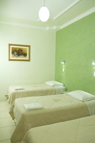 Katil atau katil-katil dalam bilik di Hotel Meri Conselheiro Lafaiete