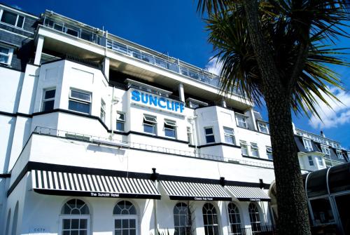 a large white house with a large window at Suncliff Hotel - OCEANA COLLECTION in Bournemouth