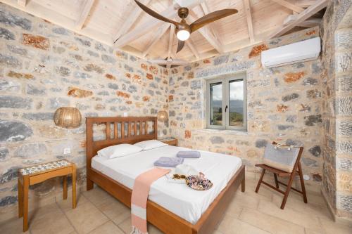 En eller flere senge i et værelse på Villa Dioni Ena