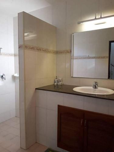 a bathroom with a sink and a mirror at phu petra villa in Ao Nang 