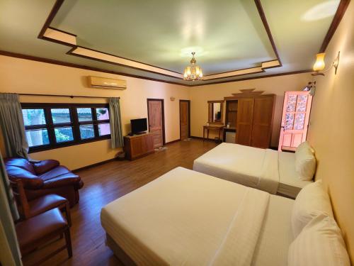 Postel nebo postele na pokoji v ubytování เขาใหญ่ฮาร์ทแลนด์ khaoyai heartland