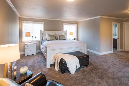 a bedroom with a bed and a couch at Beach Drive Suites in Seaside