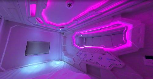 Postel nebo postele na pokoji v ubytování Kochipods