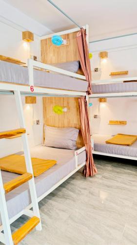 a group of bunk beds in a dorm room at Romny cozy bay Resort in Koh Rong Sanloem