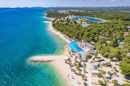 an aerial view of a beach with a resort at Sibenik Resort in Šibenik