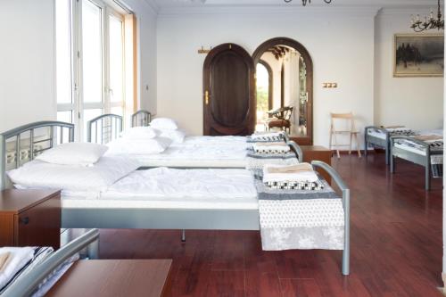 Ένα ή περισσότερα κρεβάτια σε δωμάτιο στο Magic Garden Hostel