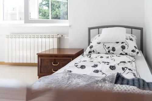 Ένα ή περισσότερα κρεβάτια σε δωμάτιο στο Magic Garden Hostel