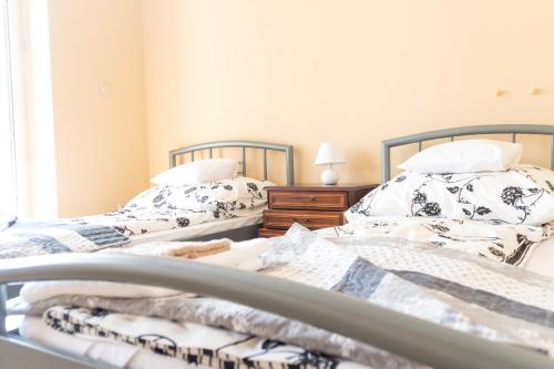 Ένα ή περισσότερα κρεβάτια σε δωμάτιο στο Magic Garden Hostel
