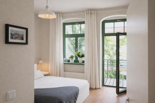 Postel nebo postele na pokoji v ubytování Hip & Minimalist - Stadt Apartments am Malerweg