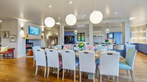a dining room with a table and chairs at Badgerwood in Winchcombe