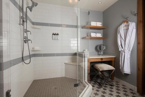 a bathroom with a shower and a sink at The Blake at Taos Ski Valley in Taos Ski Valley