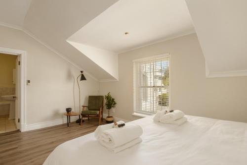 En eller flere senge i et værelse på Story Haus