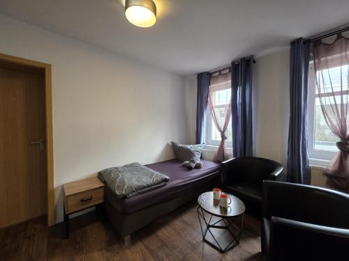 Postel nebo postele na pokoji v ubytování Mikra Homes24 in Meerane