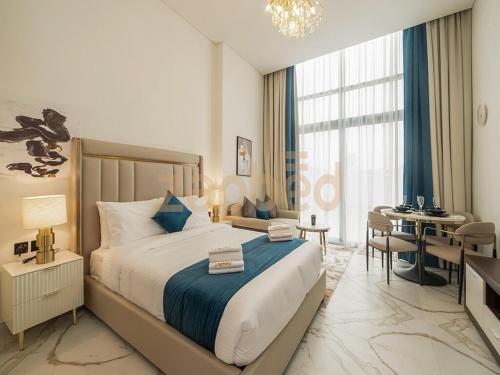 a hotel room with a bed and a desk and a room at Zapbed House-Modern Studio-Petalz By Danube in Dubai