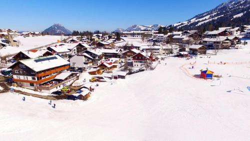 an aerial view of a village in the snow at Zum Senn - Hotel Garni in Bad Hindelang
