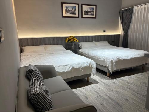 Ein Bett oder Betten in einem Zimmer der Unterkunft 陌野輕旅民宿