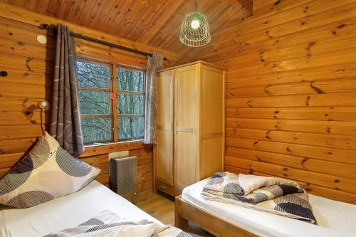 En eller flere senge i et værelse på Twistesee Ferienhaus 110