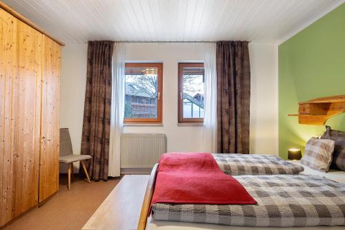 En eller flere senge i et værelse på Ferienwohnungen Im Löwengründle