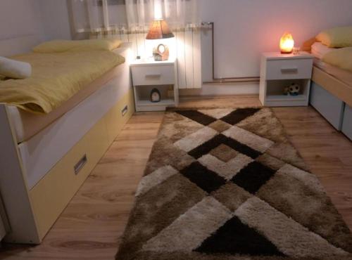 En eller flere senge i et værelse på Mountain Flower Apartment