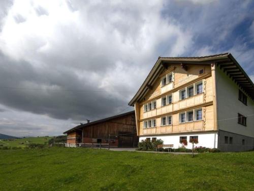 a building on a field next to a green field at Apartment Hautle by Interhome in Eggerstanden - Appenzell