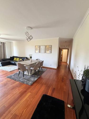 a living room with a table and chairs at Madeira Sun Loft in Funchal in Funchal