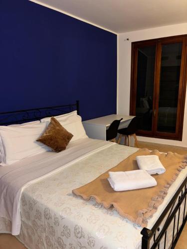 Un pat sau paturi într-o cameră la Hotel Canal Salieri