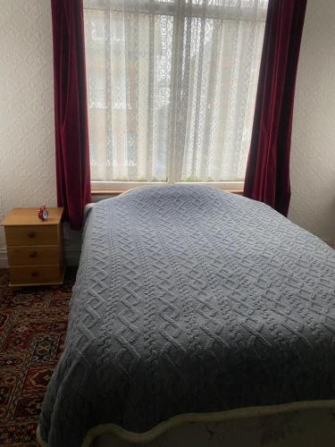 En eller flere senge i et værelse på Mickys Bed and Breakfast