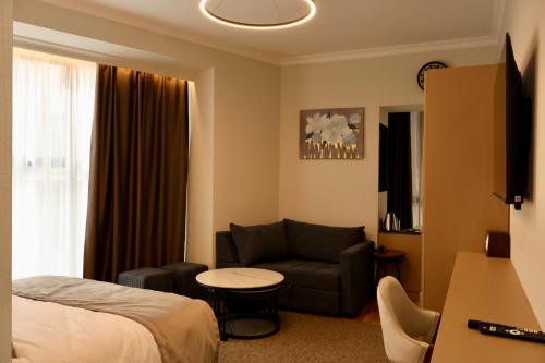 TV a/nebo společenská místnost v ubytování BM Avenue Hotel