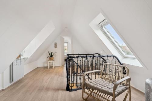 En eller flere senge i et værelse på Feriehus 4002