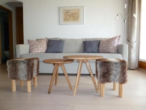 a living room with a couch and a table at Apartment Chesa Blais by Interhome in Zuoz