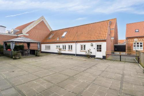 a large courtyard in a building with a pavilion at Feriehus 4002 in Ringkøbing