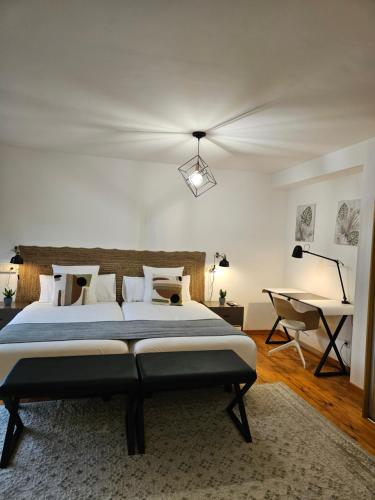 En eller flere senge i et værelse på Apartamentos Ciudad Santiago