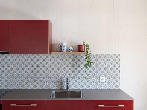 a kitchen with a sink and a counter top at Apartment Bellezza - Bio Bergün by Interhome in Bergün