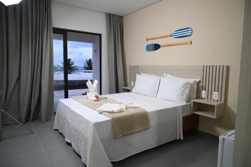 Postel nebo postele na pokoji v ubytování Maragogi Praia Hotel