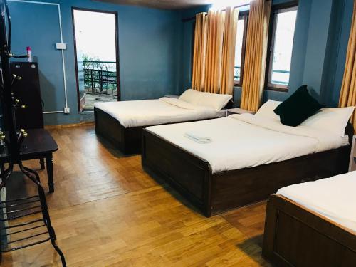 Voodi või voodid majutusasutuse Mita Hotel toas