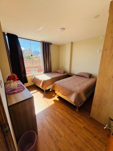 En eller flere senge i et værelse på BnbSucre