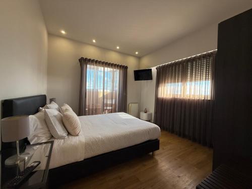 En eller flere senge i et værelse på Vasco da Gama