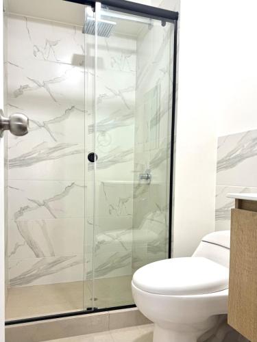 a bathroom with a shower and a toilet at Brand New Apartment in Lima