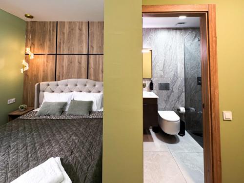 Vita Verde في توريفايجا: غرفة نوم بسرير وحمام مع دش