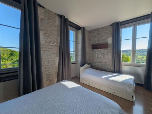 Postel nebo postele na pokoji v ubytování Domaine Ferme Sainte Anne