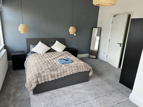 En eller flere senge i et værelse på Norton Rd Guest House