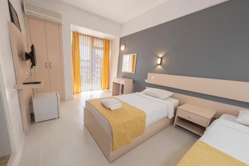 Postel nebo postele na pokoji v ubytování Afytos Akcay Tatil Koyu