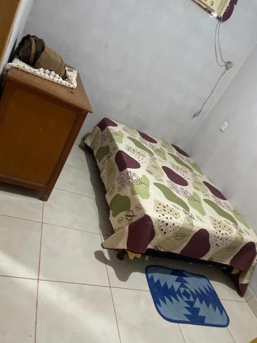 a bed sitting on the floor in a room at Casa Aurora in Chapada dos Guimarães