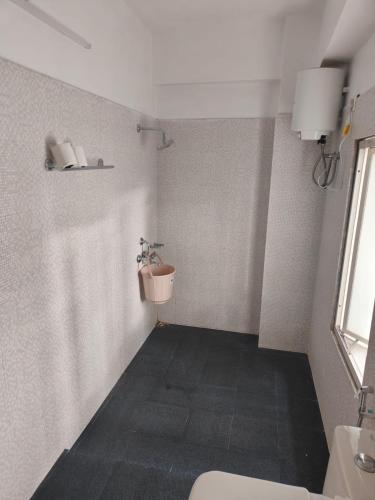 a bathroom with a toilet and a sink at D'Bonn Inn in Shillong