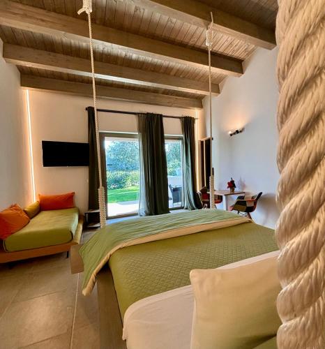 a bedroom with a bed and a large window at I SECOLARI in Sannicandro di Bari