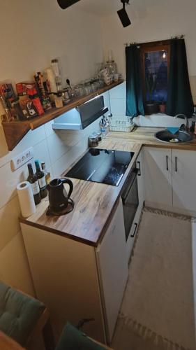 a small kitchen with a sink and a stove at vila Damascena in Pirot